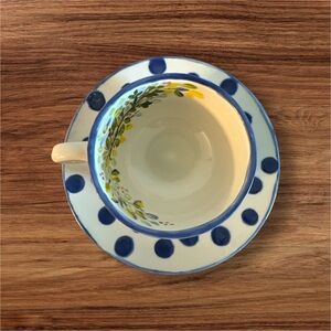 Ceramic teacup and saucer.